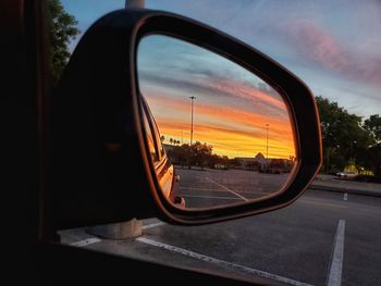 Reflection of sky on side-view mirror