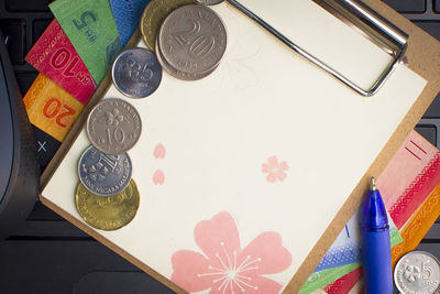 High angle view of coins on table