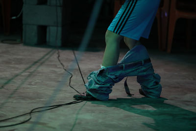 Low section of woman dancing on floor