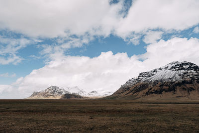 Scenic view of snowcapped mountains against sky