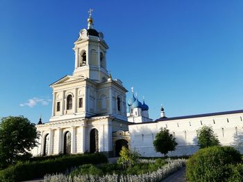 Low angle view of building against clear blue sky