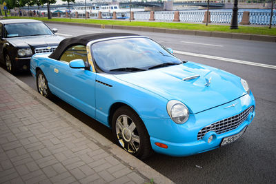 Cars parked on road in city