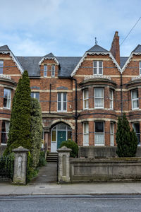 Residential building by road against sky, luxury houses in dublin