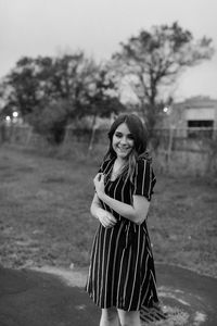 Fashionable teenage girl standing outdoors