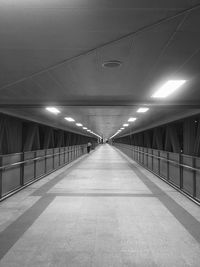 Illuminated corridor of building at night