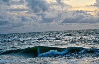 Scenic view of sea wave against sky