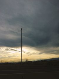 Silhouette landscape against sky during sunset