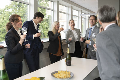 Business people celebrate with champagne