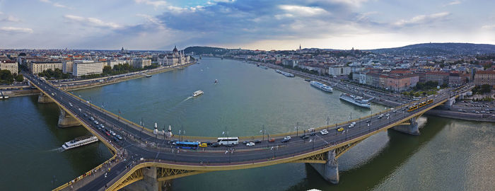 High angle view of bridge over river in city against sky