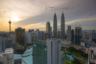 Panoramic view of cityscape against sky during sunset