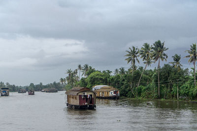 Boat in river against sky