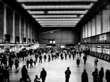 People walking on railroad station platform