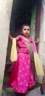 Full length of woman looking away