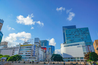 Low angle view of buildings in city against sky