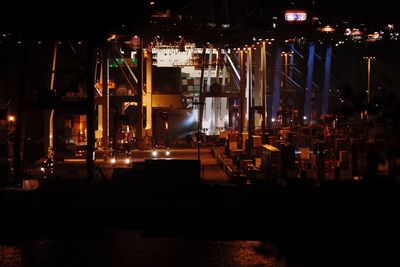 Illuminated ferris wheel at night