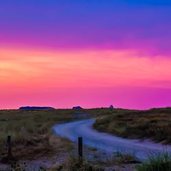 Scenic view of landscape against sky during sunset