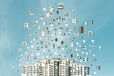 Digital composite image of buildings against sky