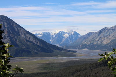 Scenic view of mountains against cloudy sky