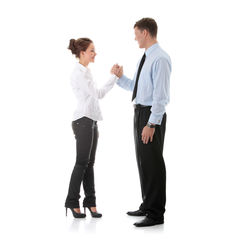 Side view of friends standing against white background