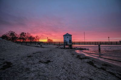 Scenic view of beach against sky during sunset