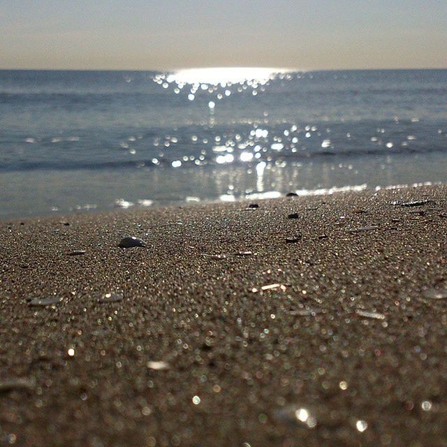 sea, water, beach, horizon over water, shore, scenics, sand, tranquility, tranquil scene, wave, beauty in nature, nature, sky, surf, surface level, idyllic, coastline, wet, outdoors, reflection