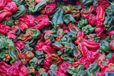 Full frame shot of red and green bell peppers for sale at market stall