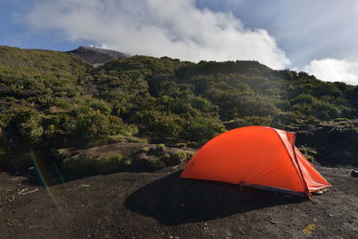 Tent on mountain against sky