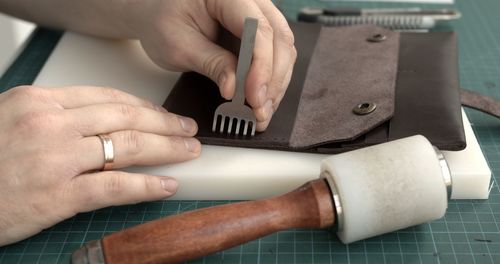 Cropped hands of person working on table