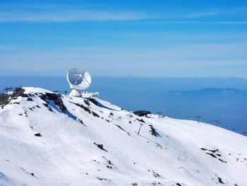 High in the sierras a satellite dish listens 