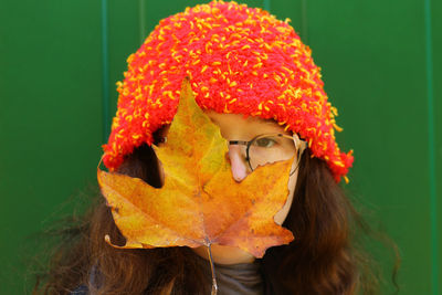 Close-up portrait of young woman wearing hat