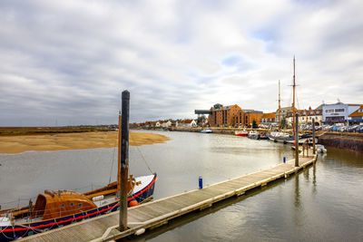 Boats moored at harbor