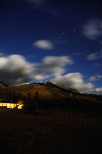 Scenic view of field against sky at night