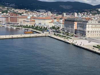 High angle view of river amidst buildings in city