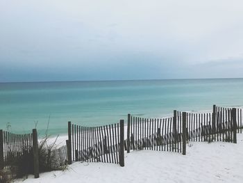 Scenic view of sea against sky during winter