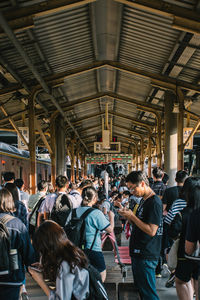 Group of people at railroad station platform