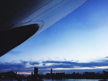 Cityscape against cloudy sky