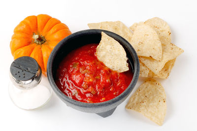 Close-up of breakfast in bowl against white background