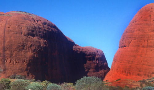 Scenic view of mountains against clear blue sky