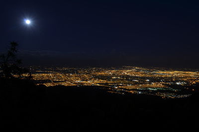 Aerial view of illuminated cityscape at night