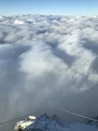 Aerial view of snowcapped mountain against sky