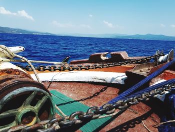 View of boats in sea against sky