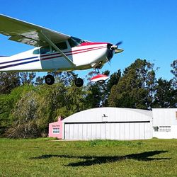 Airplane flying against clear blue sky