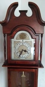 Close-up of clock on wood