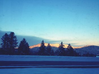 Scenic view of snow covered mountains against sky