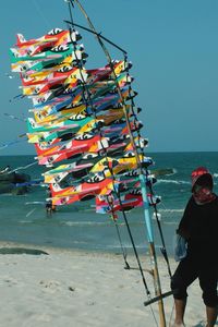 Person selling kites on beach