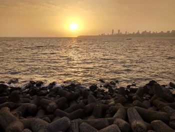 Scenic view of sea against sky during sunset