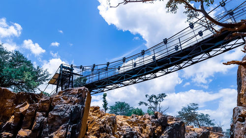 Low angle view of metallic structure against sky