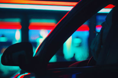 Close-up of man smoking while sitting in car