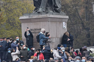 Group of people standing in a city