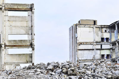 Low angle view of abandoned building against sky